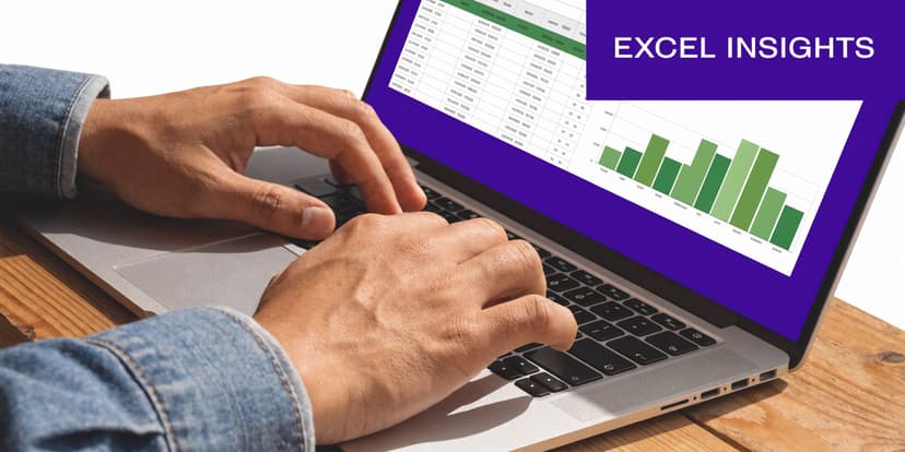 A person using a laptop with an Excel spreadsheet and bar chart displayed on the screen.