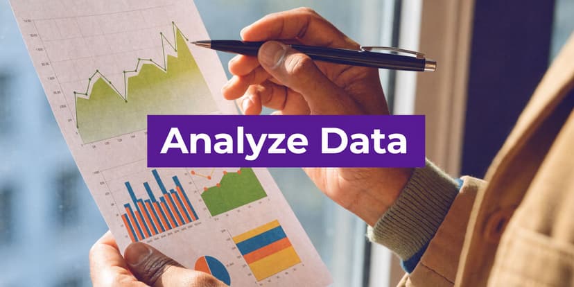 A professional analyzing charts and financial data on a paper document held in their hands.