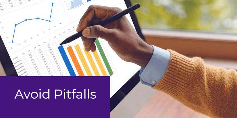 A person using a stylus to point at a sales forecast chart on a computer screen.