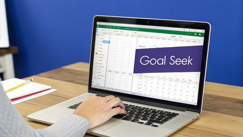 A person uses a laptop displaying an Excel spreadsheet with a "Goal Seek" overlay.